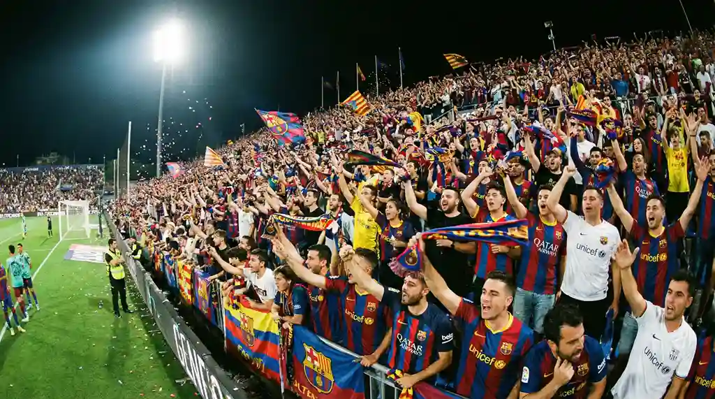 Kibice oglądający mecz piłkarski na stadionie